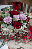 Cut roses in centrepiece on dining table in Berkshire home,  England,  UK