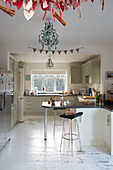 Stool at breakfast bar with Christmas bunting in Laughton home  Sheffield  UK