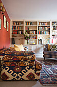 Brown patterned sofa and bookcase in Warminster living room  Wiltshire  England  UK