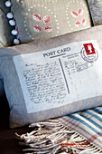 Light grey cushion with postcard fabric in Wokingham cottage Berkshire UK