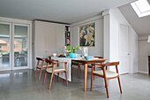 1940s Danish dining table and chairs in modernised Victorian cottage Sussex England UK