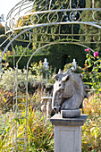 Equestrian statue and pergola in back garden Hampshire England UK