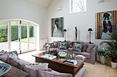 Large artworks in living room conversion of Gloucestershire farmhouse England UK