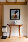 Framed artwork and ceramic pot with lantern in Gloucestershire farmhouse England UK