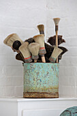 Brushes in tin in South London schoolhouse conversion UK
