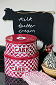 Cake tins and chalkboard with egg holder in Gloucestershire kitchen UK