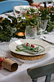 Cut flower on place setting at Christmas in West Sussex home UK