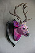 Wall mounted tartan deer head in Hampshire home UK