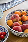 peaches in fruit bowl on table in Grade II listed cottage Cornwall UK