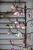 Assorted Christmas baubles on metal stand in Norwich home Norfolk UK