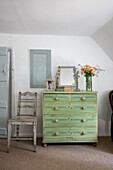 Upcycled chest of drawers and antique chair in Surrey cottage UK
