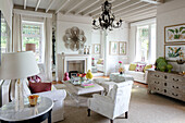 White lamp on side table with ornament above fireplace Wales UK