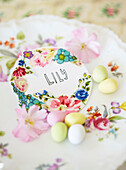 PLace name 'LILY' with easter eggs on side plate