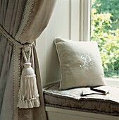Quiet space on a window seat with cushions