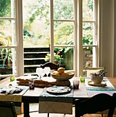 Kitchen dining room table setting and open patio doors