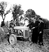 Mayors inspecting tractor purchased under the Marshall Plan