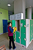 Woman using public locker