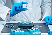 Laboratory technician holding a micro dose of psilocybin
