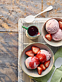 Strawberry ice cream with fresh strawberries and strawberry coulis