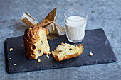 Small panettone with a glass of milk