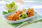 Chicken in cornflake coating with salad