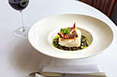 Cod fillet with ham and Puy lentils