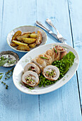 Turkey roll with peas and baked potatoes