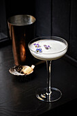 Pisco Sour garnished with flowers