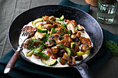 Vegan seitan mushroom pan with braised cucumber and mustard-dill sauce