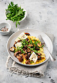 Omelette with fried mushrooms and rocket salad