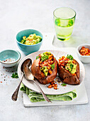 Stuffed sweet potatoes with guacamole and beans