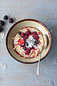 Porridge with berries, chia seeds and natural yoghurt