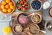 Ingredients for a healthy breakfast with granola and fruit