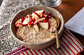 Porridge with apples and pomegranate seeds