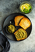 Healthy breakfast with toasts and pesto sauce