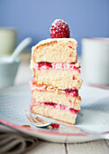 A slice of raspberry buttercream cake