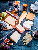 Assorted cheeses with figs and grapes