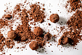 Homemade dark chocolate cocoa truffle candy with cocoa powder over white