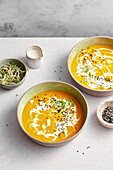 Carrot Ginger Soup served in a ceramic bowl