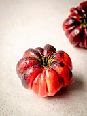 Several red tomatoes on a white table