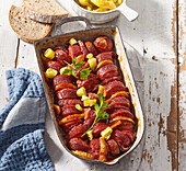 Beer braised sausages with chili peppers