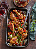 Baked chicken drumsticks with olives and tomatoes