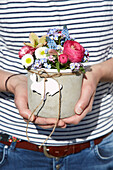 Spring bouquet with Easter decoration in DIY concrete pot