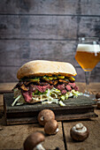 Steak sandwich with mushrooms and pickles