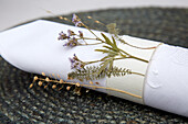 Napkin with DIY paper napkin ring and dried flowers