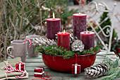 DIY Advent wreath in red enamel bowl