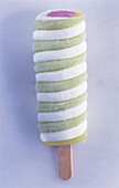 White and green Popsicle with a pink center