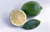 Whole lime, lime half and lime leaf