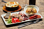 A selection of Spanish tapas on a wooden table