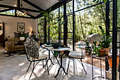 Open living room with dining area in the glass house